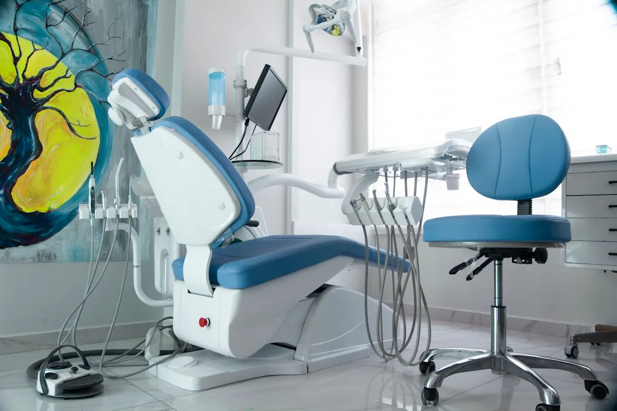A treatment room with chair and equipment